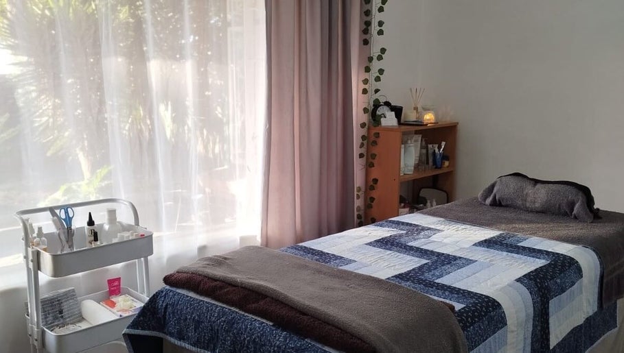 Peaceful treatment room at Mekyla Wellness in Gqeberha, Eastern Cape, ZA, offering a tranquil ambiance for relaxation.