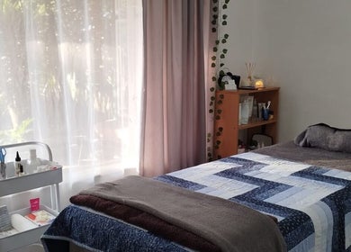 Peaceful treatment room at Mekyla Wellness in Gqeberha, Eastern Cape, ZA, offering a tranquil ambiance for relaxation.