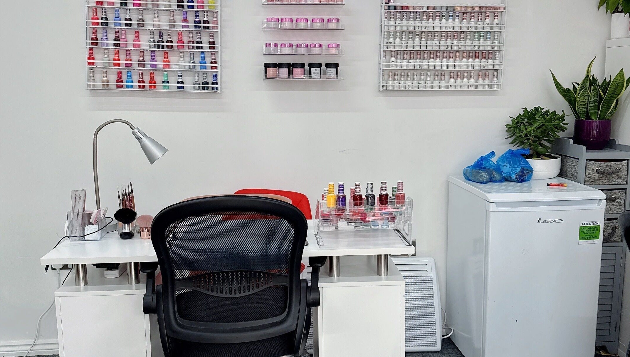 Manicure station at Willownails, Bristol, Willsbridge, GB with colorful polish display and tidy setup.