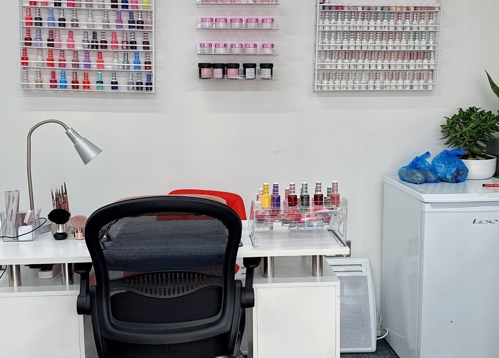 Manicure station at Willownails, Bristol, Willsbridge, GB with colorful polish display and tidy setup.