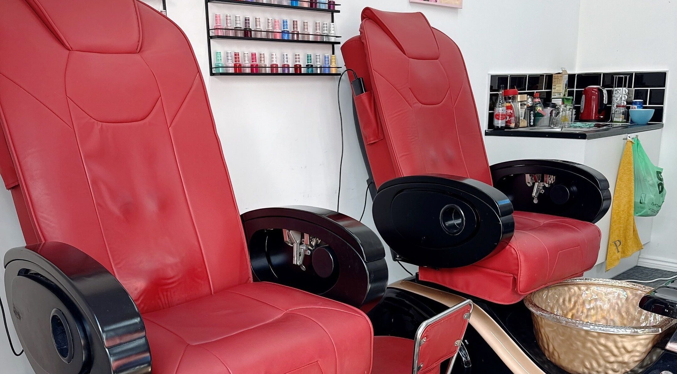 Luxurious red pedicure chairs at Willownails, Bristol, Willsbridge, GB, offering a premium nail experience.
