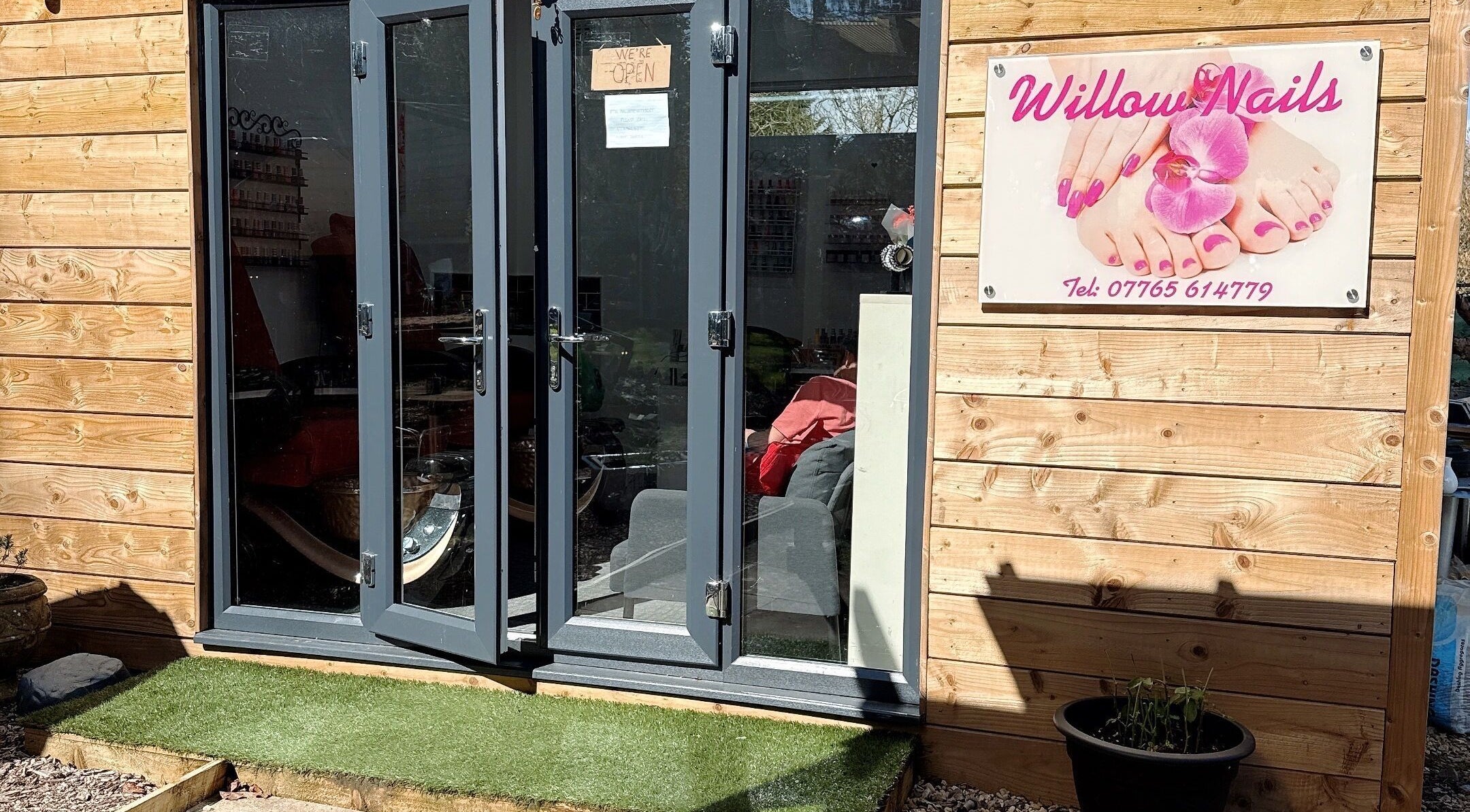 Entrance to Willownails with open doors and sign in Bristol, Willsbridge, GB.