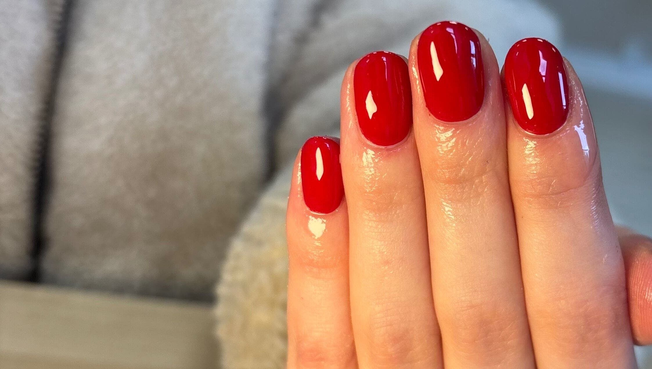 Chic red manicure at Ibrowednlashed, Glasgow, Scotland, GB. Perfectly polished for a bold look.