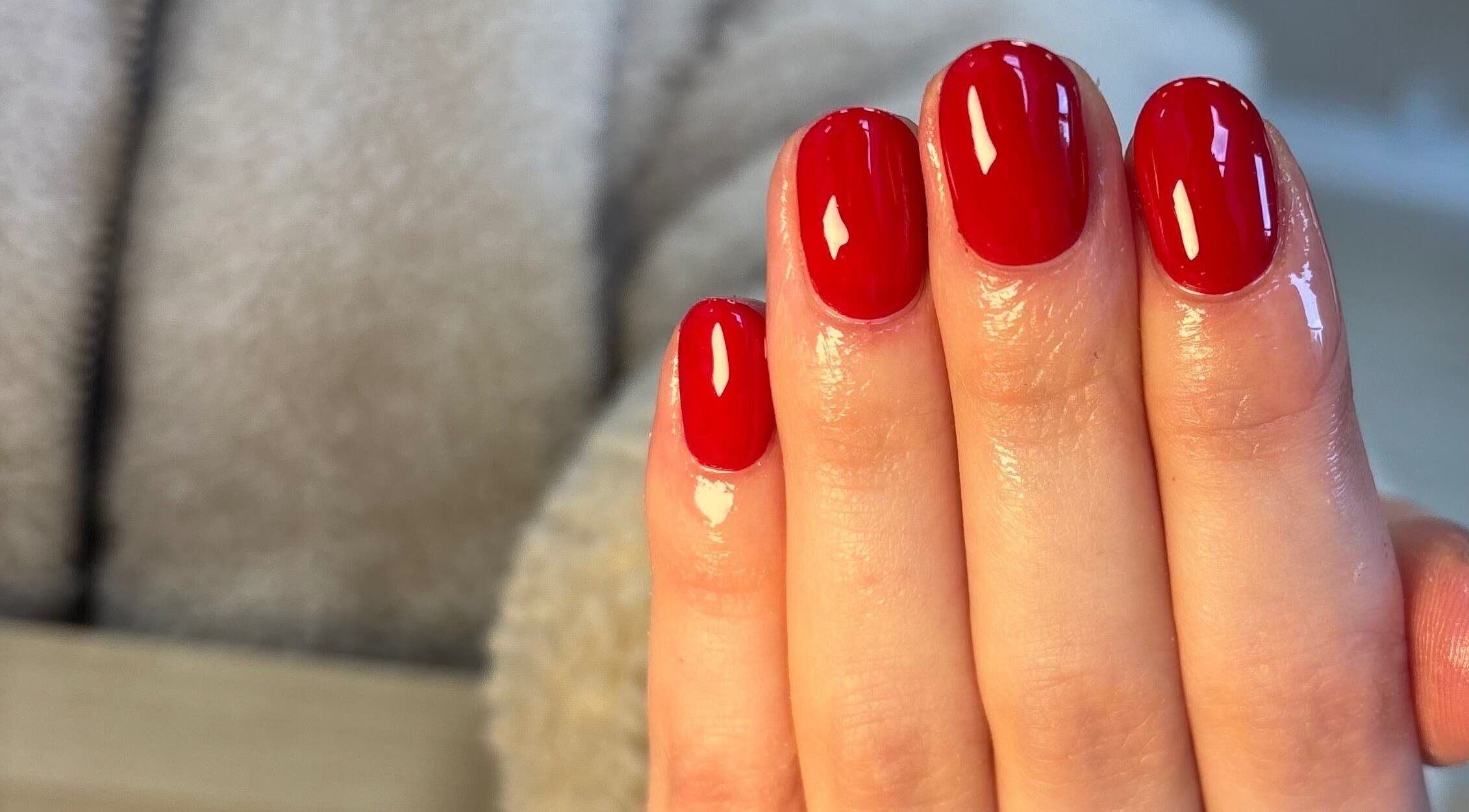Chic red manicure at Ibrowednlashed, Glasgow, Scotland, GB. Perfectly polished for a bold look.