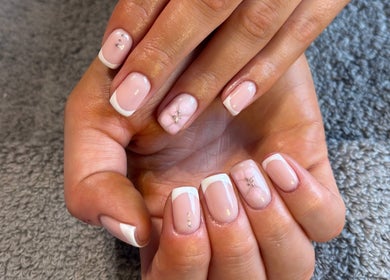 Stunning French manicure at HSbeauty in Maidstone, England, GB showcasing delicate nail art.