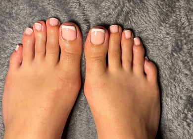 Well-groomed toes with pink polish at HSbeauty, Maidstone, England, GB, showcasing pedicure expertise.