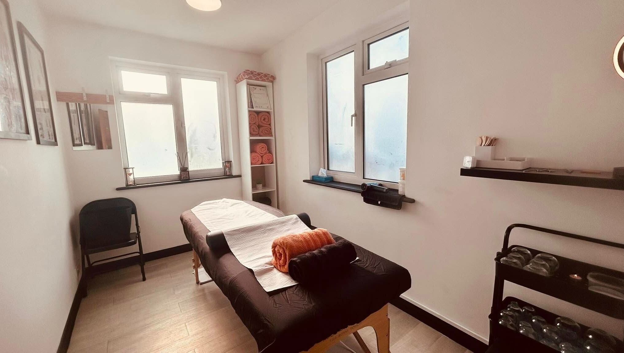 Tranquil therapy room at Revive Massage Therapy, Guernsey, Vale, GG with massage table and calming decor.