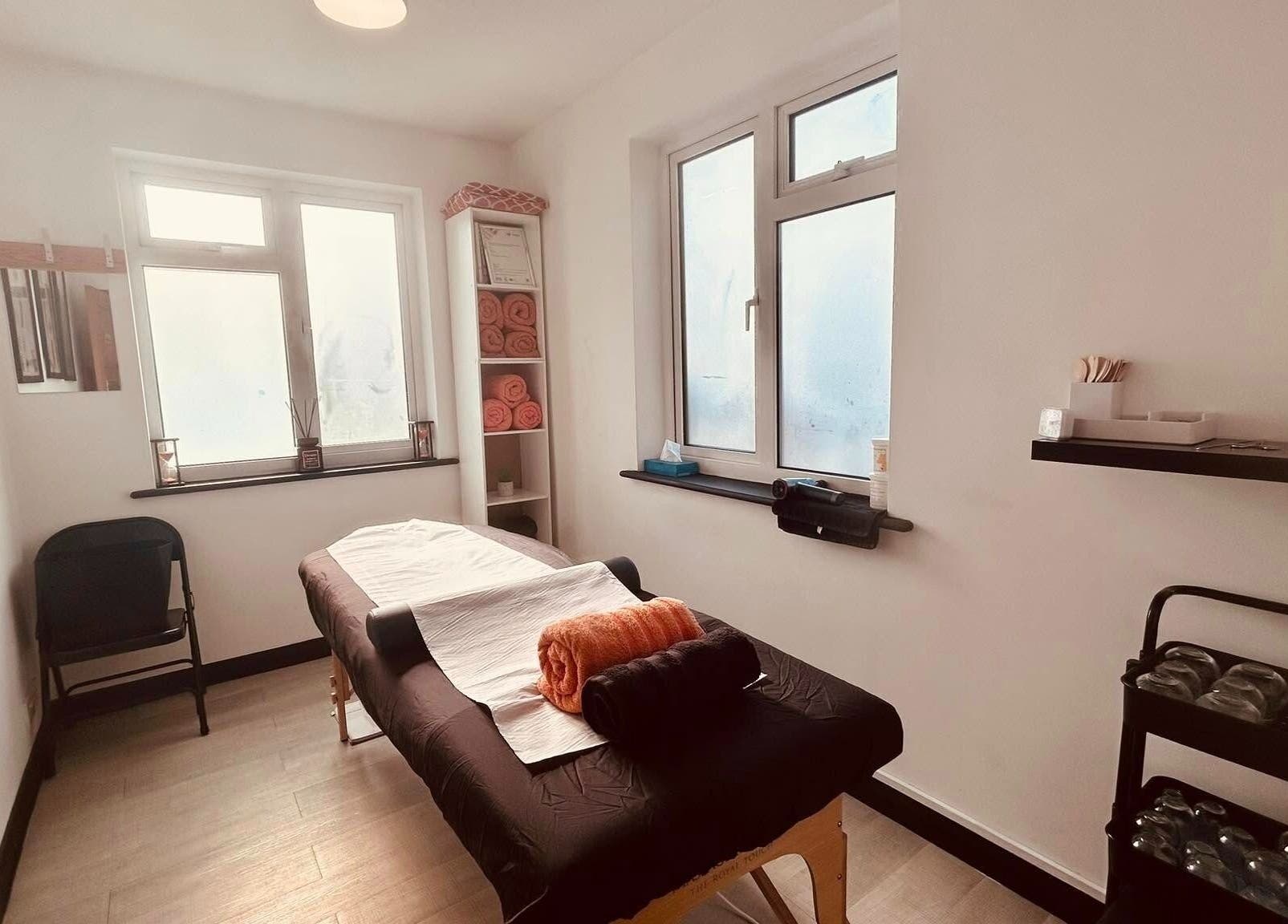 Tranquil therapy room at Revive Massage Therapy, Guernsey, Vale, GG with massage table and calming decor.