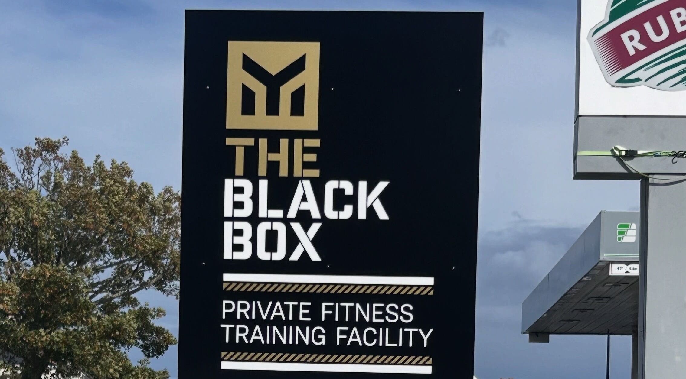 Sign at Revive Massage Therapy, Guernsey, Vale, GG advertising private fitness training facility.