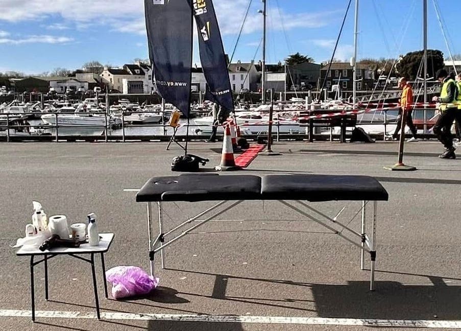 Outdoor massage table by harbor at Revive Massage Therapy, Guernsey, Vale, GG.