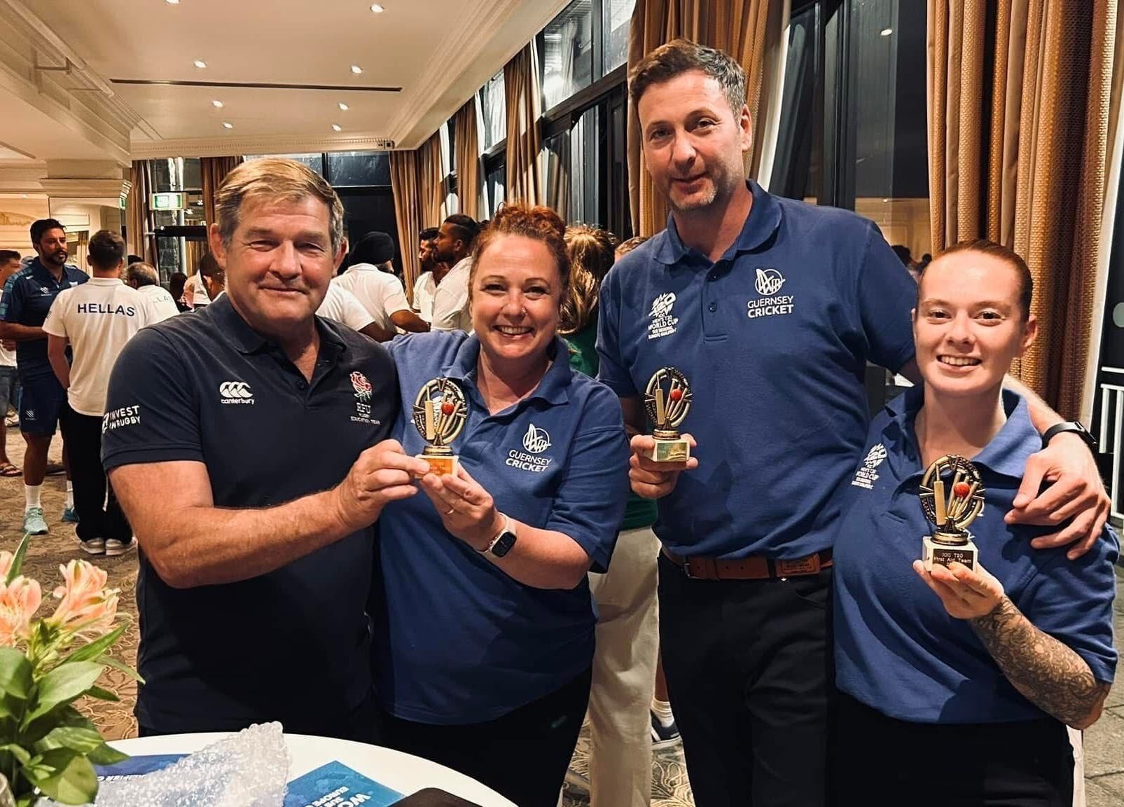 A happy group holding trophies at Revive Massage Therapy, Guernsey, Vale, GG.