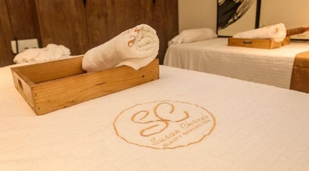 Relaxing massage table setup at SUSAN CHANEL BEAUTY SKINLINE - ALLEN in Ikeja, Lagos, NG with branded linens.