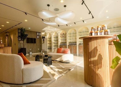 Elegant lounge at SUSAN CHANEL BEAUTY SKINLINE - ALLEN, Ikeja, Lagos, NG with plush seating and product displays.