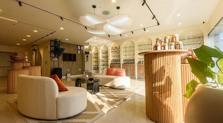 Elegant lounge at SUSAN CHANEL BEAUTY SKINLINE - ALLEN, Ikeja, Lagos, NG with plush seating and product displays.