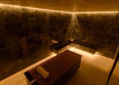 Luxurious treatment room at SUSAN CHANEL BEAUTY SKINLINE - ALLEN in Ikeja, Lagos, NG with dim ambient lighting.