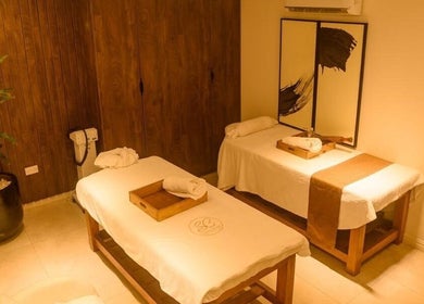Massage room at SUSAN CHANEL BEAUTY SKINLINE - ALLEN, Ikeja, Lagos, NG with two beds and spa decor.