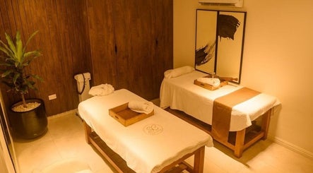 Massage room at SUSAN CHANEL BEAUTY SKINLINE - ALLEN, Ikeja, Lagos, NG with two beds and spa decor.