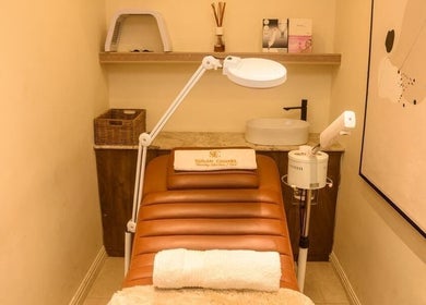Cozy spa room at SUSAN CHANEL BEAUTY SKINLINE - ALLEN in Ikeja, Lagos, NG, featuring a treatment bed and lamp.