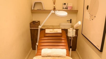 Cozy spa room at SUSAN CHANEL BEAUTY SKINLINE - ALLEN in Ikeja, Lagos, NG, featuring a treatment bed and lamp.