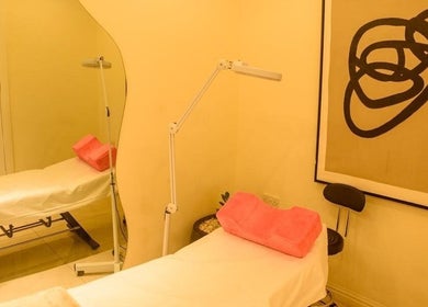 Relaxing treatment room at SUSAN CHANEL BEAUTY SKINLINE - ALLEN, Ikeja, Lagos, NG featuring a cozy bed.