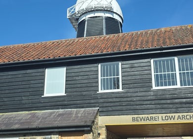 STUDIO19 at charming rustic building with observatory in Cambridge, England, GB under clear blue sky.