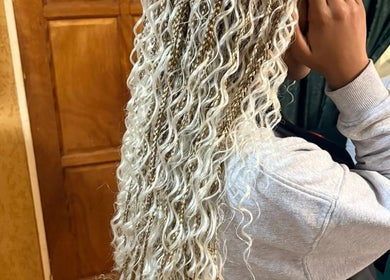 Intricate blonde braids and waves hairstyle at Amin Beauty Salon, Cape Town, Western Cape, ZA.