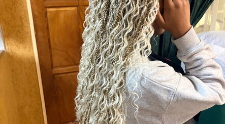 Intricate blonde braids and waves hairstyle at Amin Beauty Salon, Cape Town, Western Cape, ZA.
