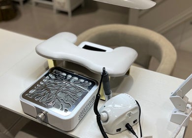 Nail station at Khristi Nails, London, England, GB, featuring modern manicure equipment.