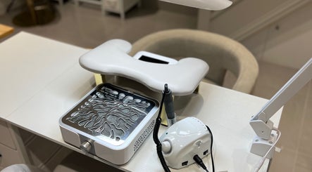 Nail station at Khristi Nails, London, England, GB, featuring modern manicure equipment.