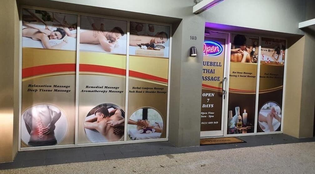 Front view of Blue Belle massage center in Robina, Queensland, AU with various service ads.
