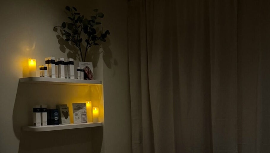 Calming candlelit shelves at Emily - Skin Rest Results, Sheffield, England, GB, showcasing beauty products.