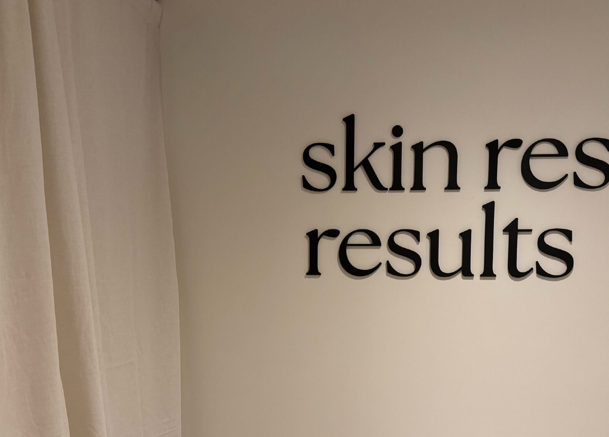 Wall sign at Emily - Skin Rest Results, Sheffield, England, GB, featuring 'skin rest results' text.