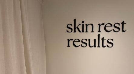Wall sign at Emily - Skin Rest Results, Sheffield, England, GB, featuring 'skin rest results' text.
