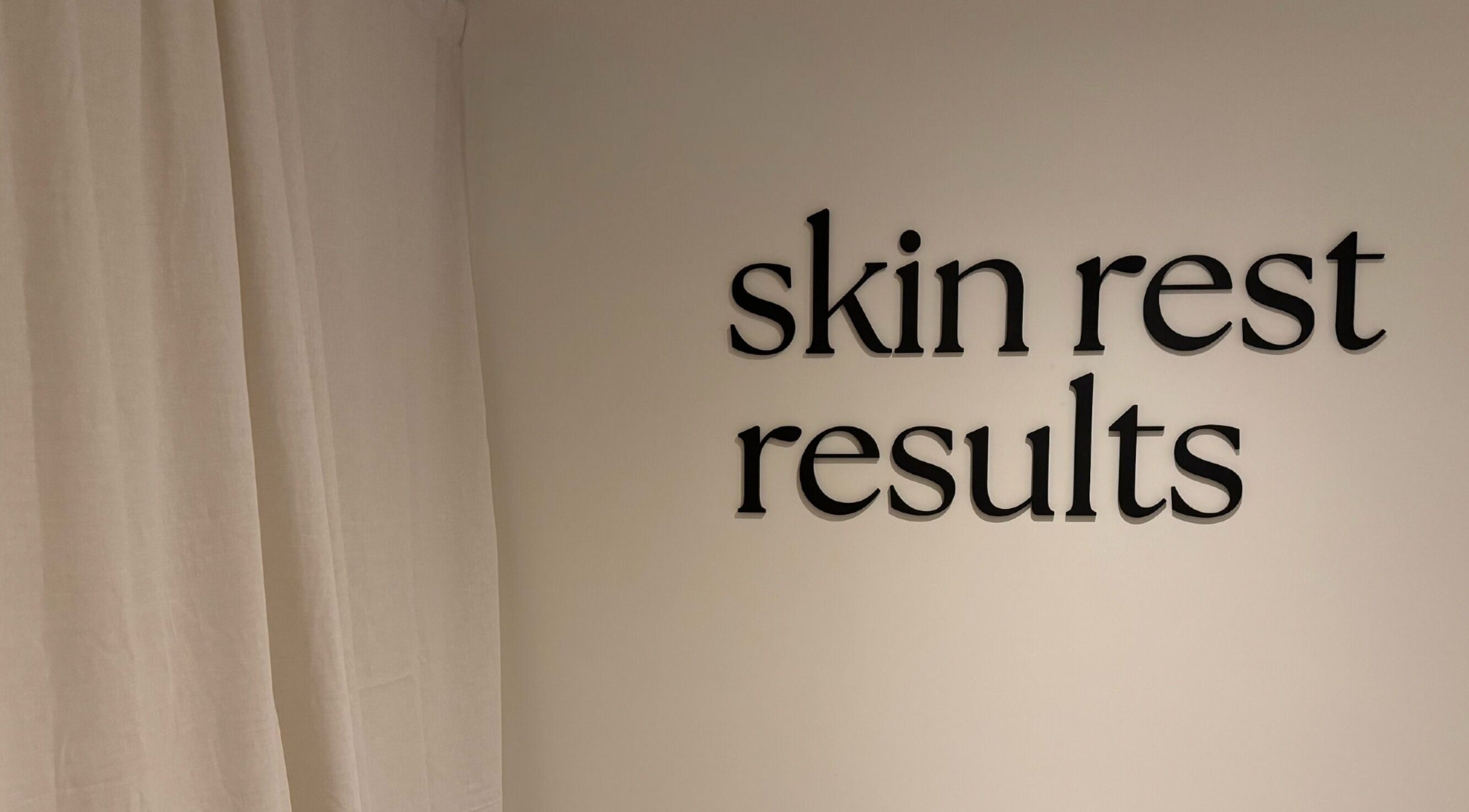 Wall sign at Emily - Skin Rest Results, Sheffield, England, GB, featuring 'skin rest results' text.