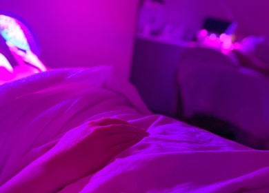 Relaxing LED facial session at Emily - Skin Rest Results in Sheffield, England, GB under soothing pink lights.