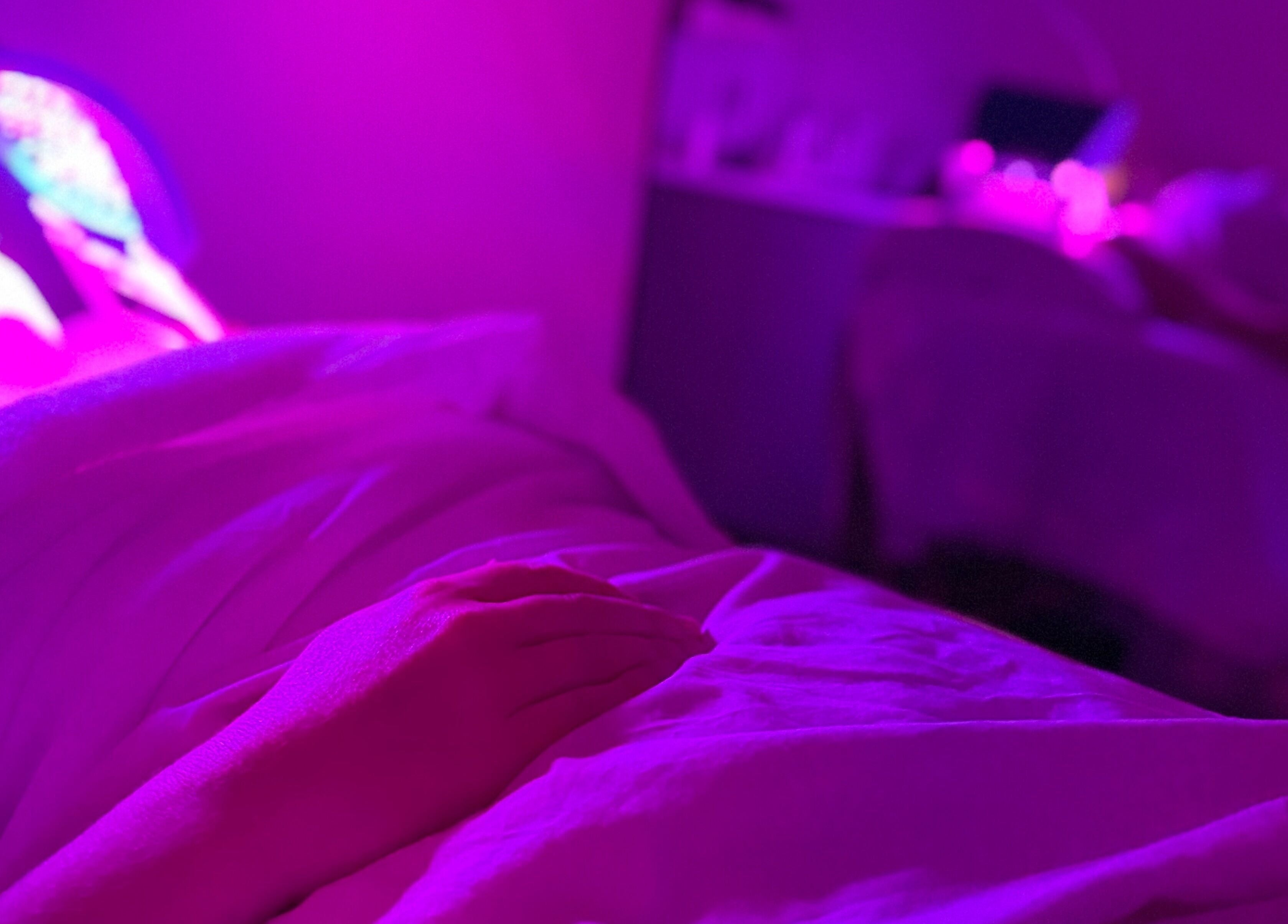 Relaxing LED facial session at Emily - Skin Rest Results in Sheffield, England, GB under soothing pink lights.