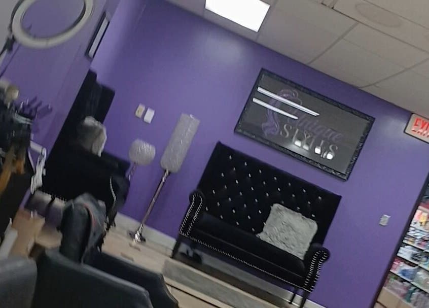 Modern seating area with purple decor at Acyileez Truth, Nashville, Tennessee, US, offering a stylish vibe.