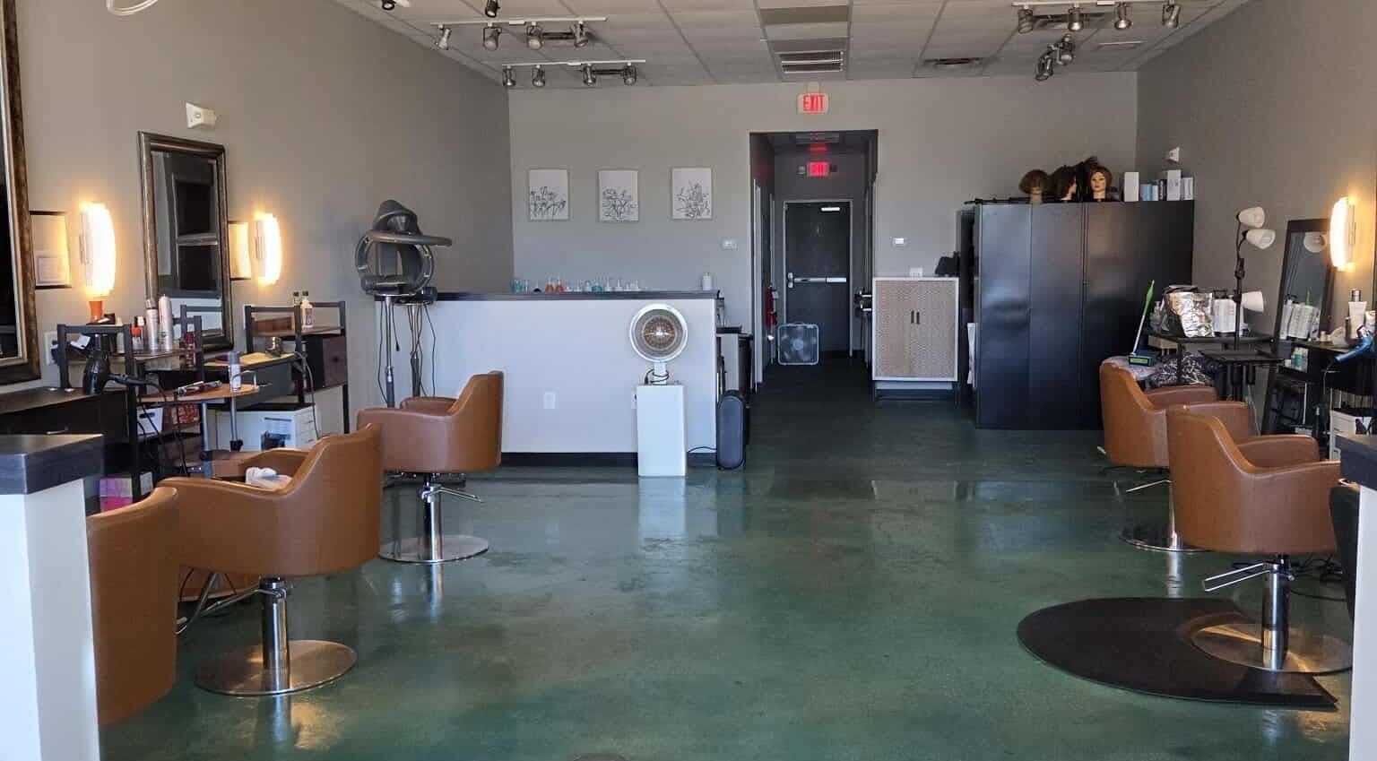 Stylish interior of Crowned by Pretty Queen in Moncks Corner, South Carolina, US with sleek salon chairs.