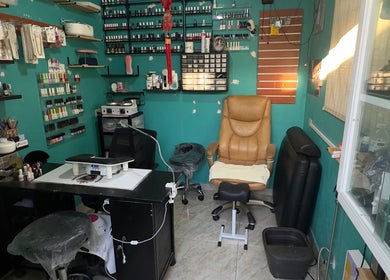Cozy nail treatment space at JPOSH, Portmore, St. Catherine Parish, JM, featuring chairs and nail products.