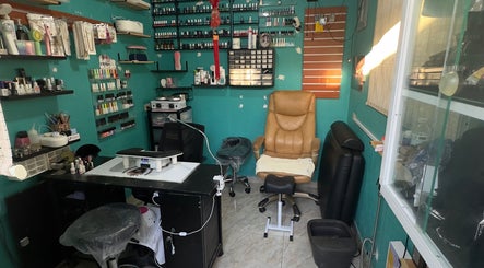 Cozy nail care area at JPOSH, Portmore, St. Catherine Parish, JM, with nail polish display and plush seating.