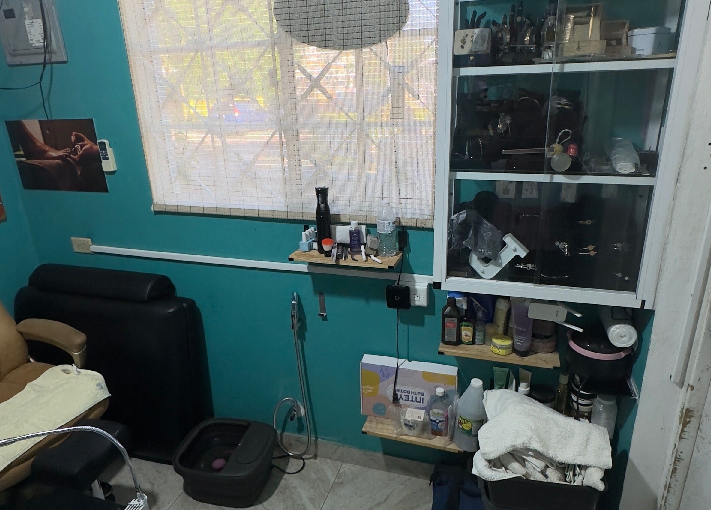 Inviting salon setup at JPOSH in Portmore, St. Catherine Parish, JM with a comfy chair and pampering station.