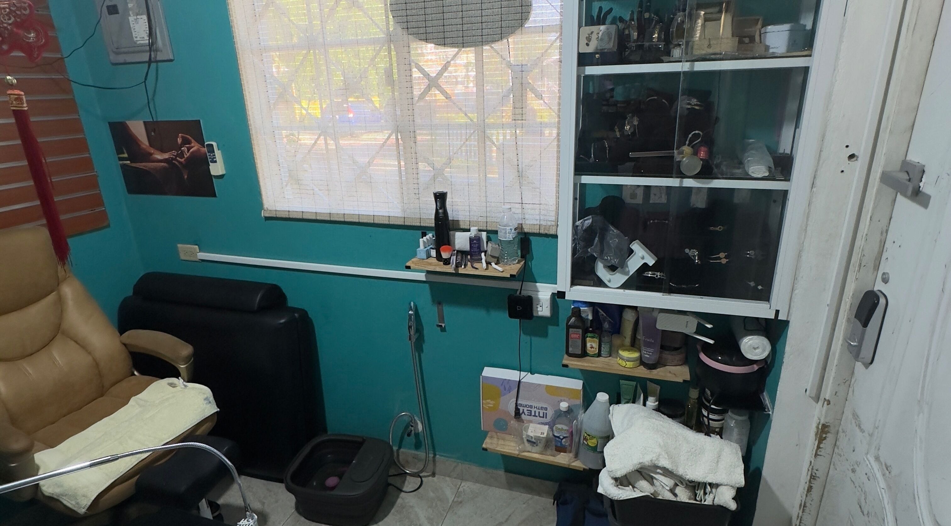 Inviting salon setup at JPOSH in Portmore, St. Catherine Parish, JM with a comfy chair and pampering station.