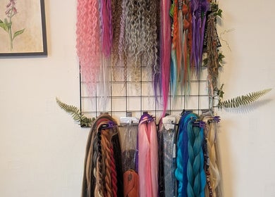 Colorful hair extensions at Foxglove Beauty, Radcliffe, England, GB, enhancing salon's vibrant ambience.