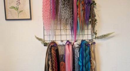 Colorful hair extensions at Foxglove Beauty, Radcliffe, England, GB, enhancing salon's vibrant ambience.
