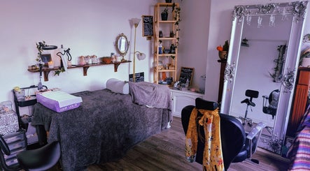Relaxing beauty room at Foxglove Beauty in Radcliffe, England, GB, featuring cozy decor and a large ornate mirror.