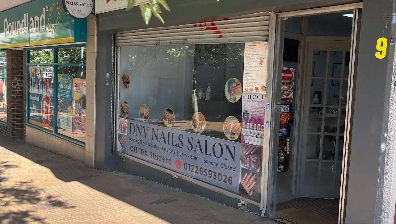 Entrance of DNV NAILS SALON, Barnsley, England, GB with signage offering 10% student discount.