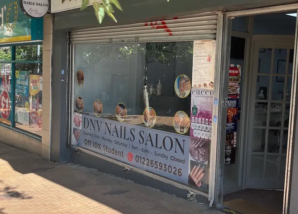 Entrance of DNV NAILS SALON, Barnsley, England, GB with signage offering 10% student discount.