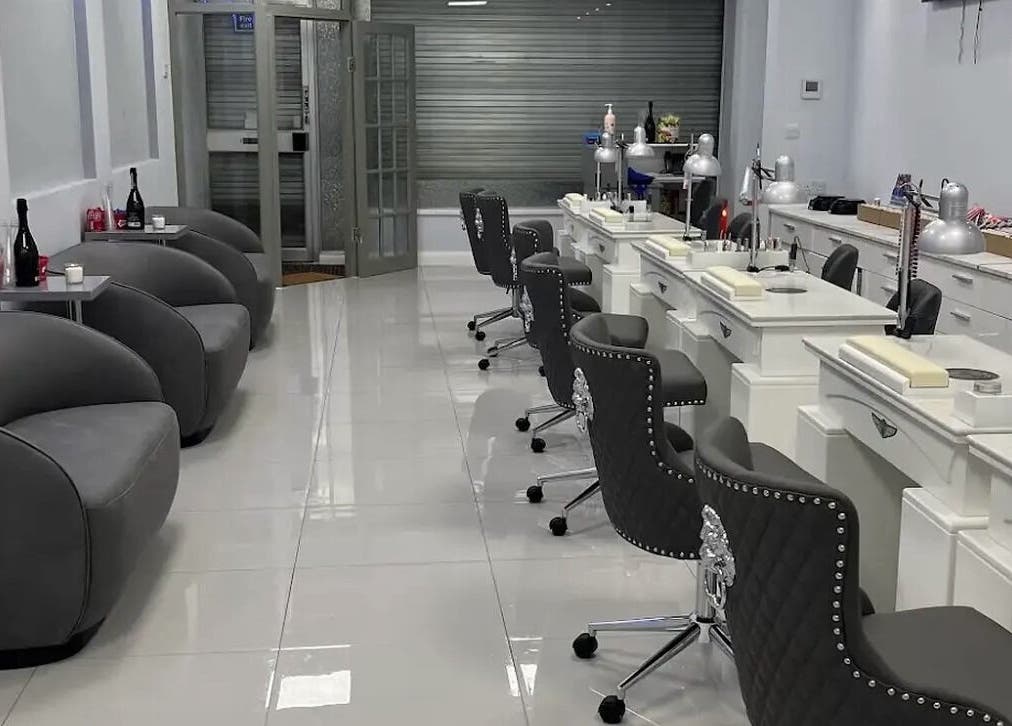 Stylish interior of DNV NAILS SALON in Barnsley, England, GB showcasing modern nail station and comfy seating.