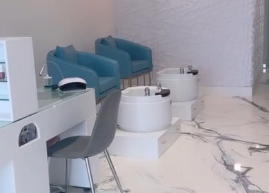 Modern pedicure and manicure station at Bella’s Image Salon, Miami Gardens, Florida, with stylish seating.