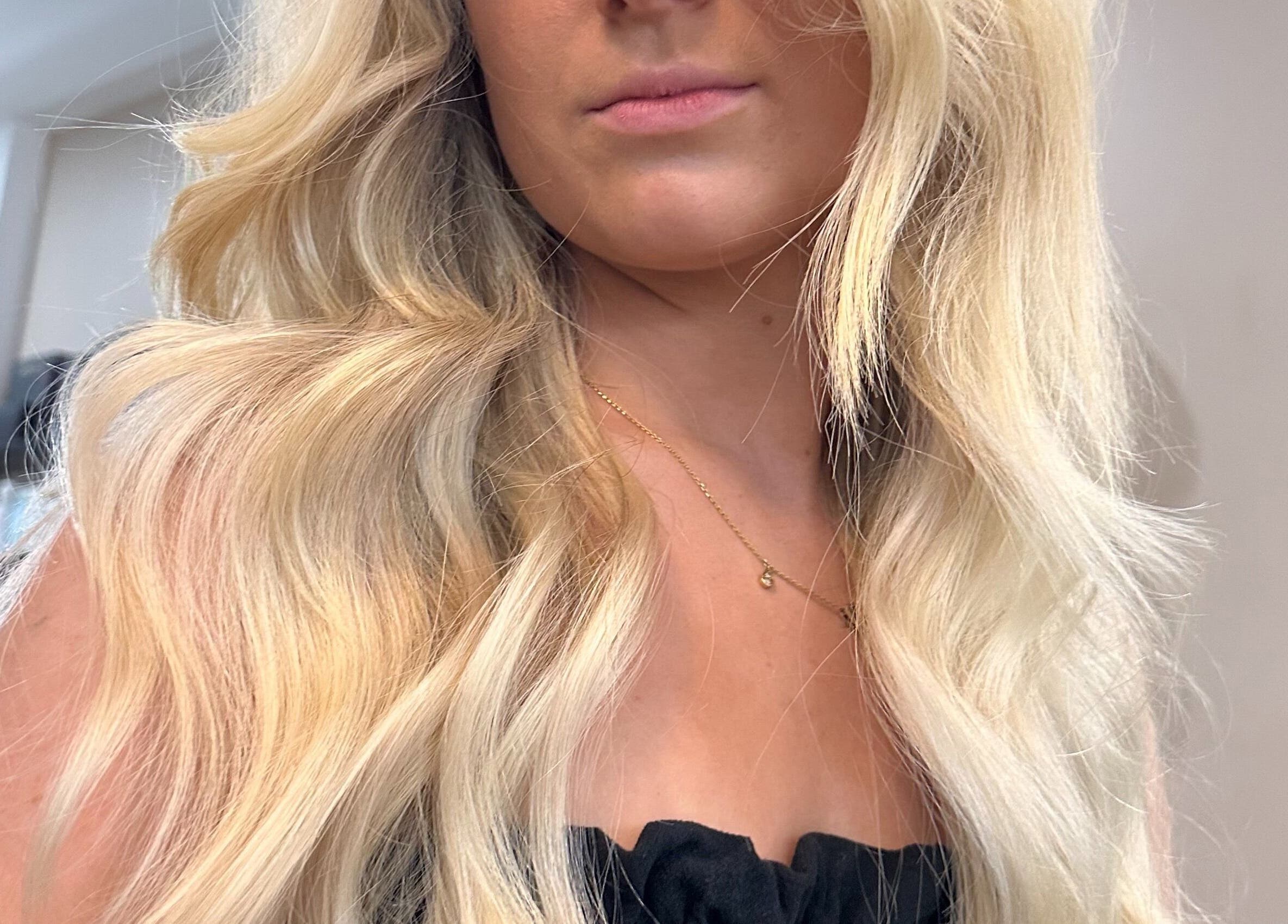 Stylish long blonde waves at Runway, Tamworth, New South Wales, AU, complementing beauty and elegance.